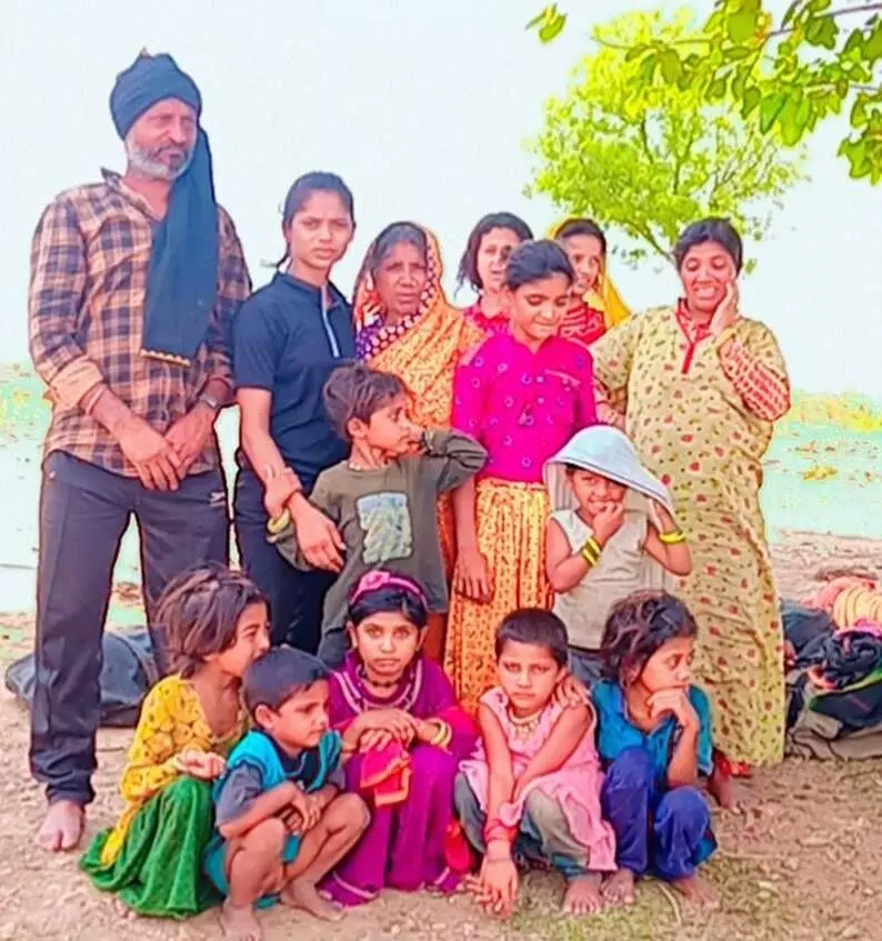 Neelam with her family members in her Khamtara village in Panna.