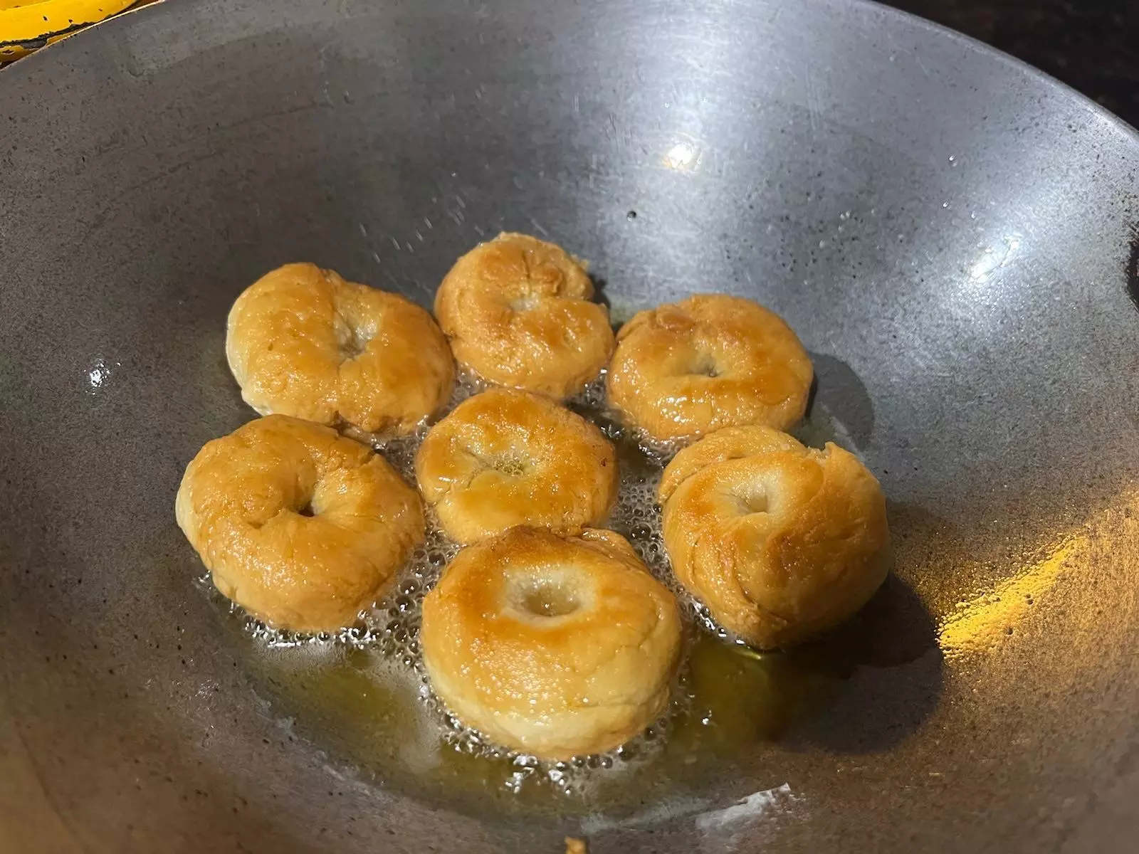 Take the balushahi out once they are light brown and straight away dip them in warm sugar syrup. Take the balushahi out once they are light brown and straight away dip them in warm sugar syrup.