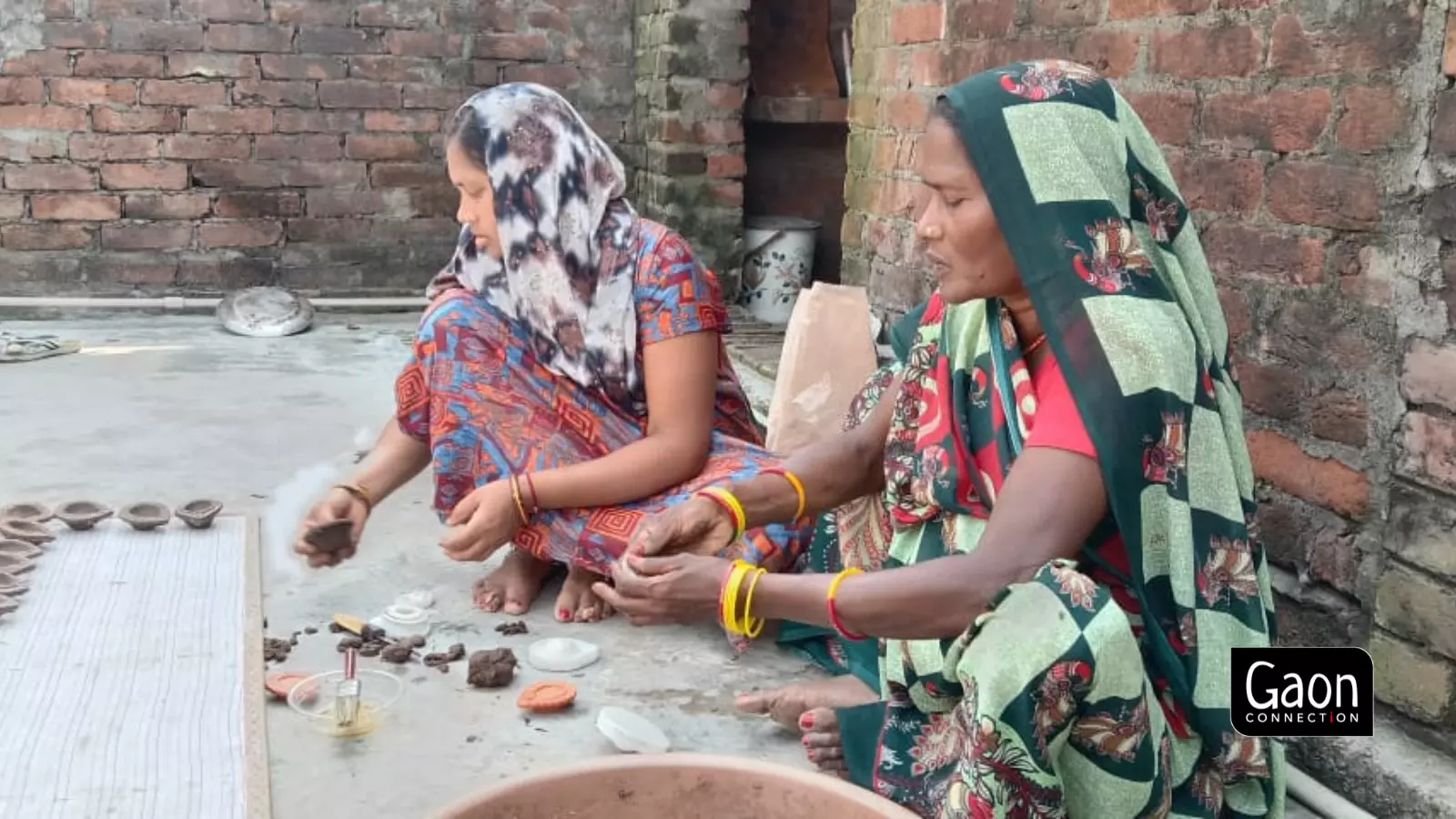 Water and cow dung are mixed with a binding agent known as gorgam to protect diyas from fire. Water and cow dung are mixed with a binding agent known as gorgam to protect diyas from fire.