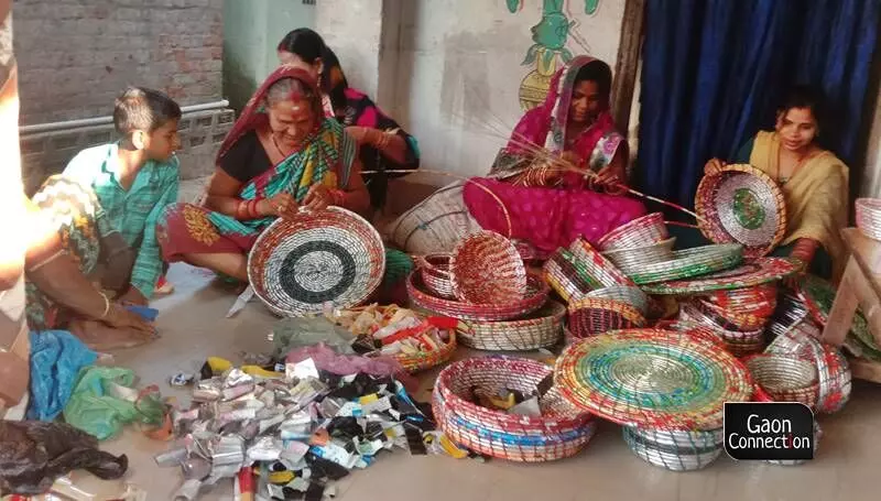 The women collect the plastic waste such as milk packets, biscuit foil and so on, and then thoroughly clean and dry them. The plastic is cut into manageable sized strips and then stitched or plaited together to make the products. The women collect the plastic waste such as milk packets, biscuit foil and so on, and then thoroughly clean and dry them. The plastic is cut into manageable sized strips and then stitched or plaited together to make the products.