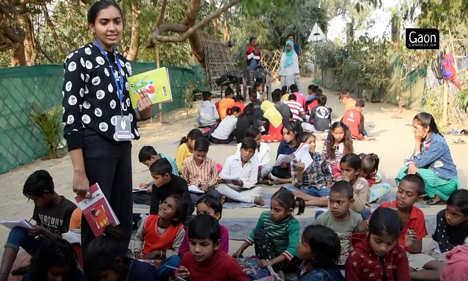 Young volunteers take out time to teach the children at Dream School. Young volunteers take out time to teach the children at Dream School.