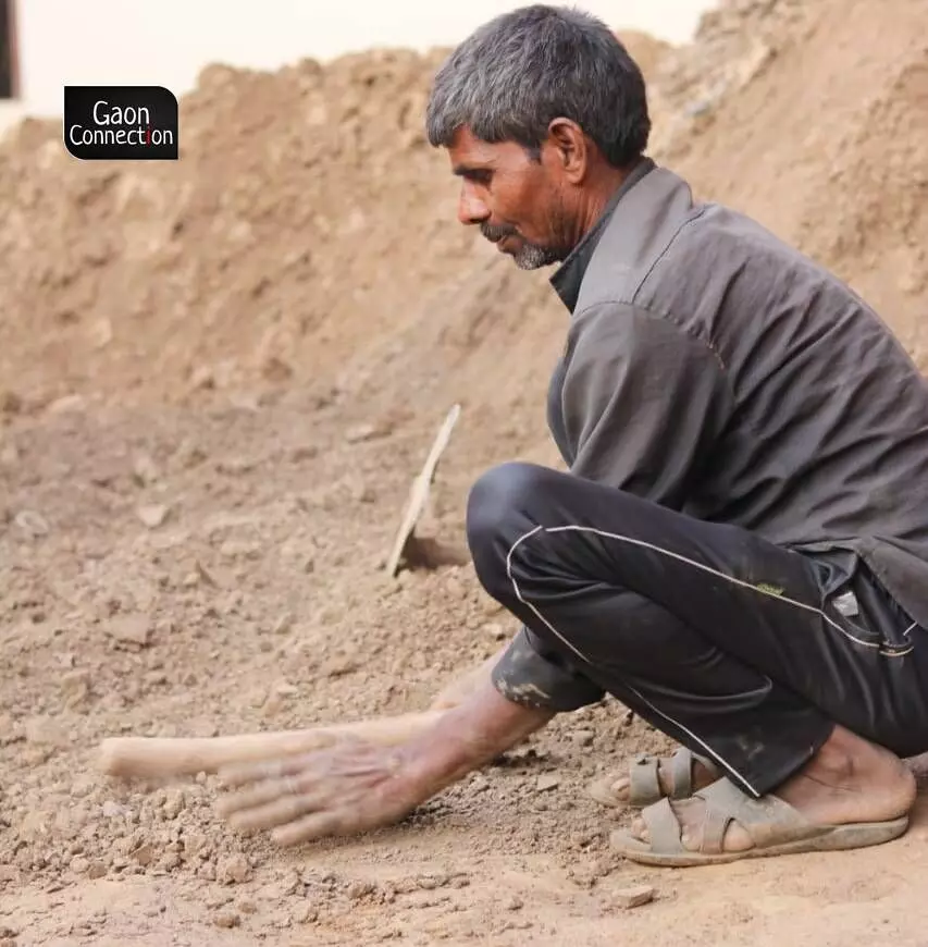 A potter sourcing mud for pottery. A potter sourcing mud for pottery.