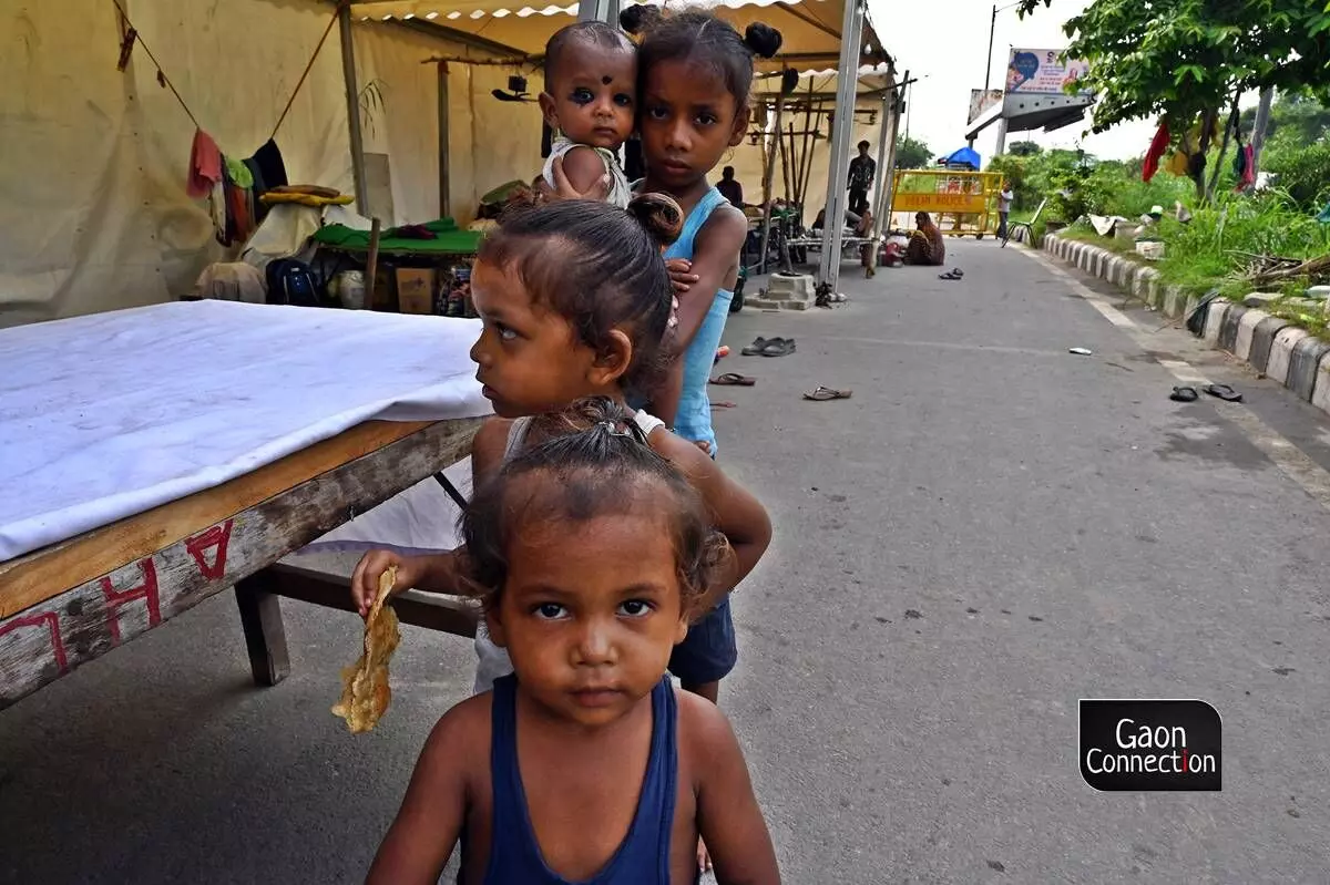 Kids pose for a photograph at the relief camps in Delhis Mayur Vihar. Kids pose for a photograph at the relief camps in Delhis Mayur Vihar.