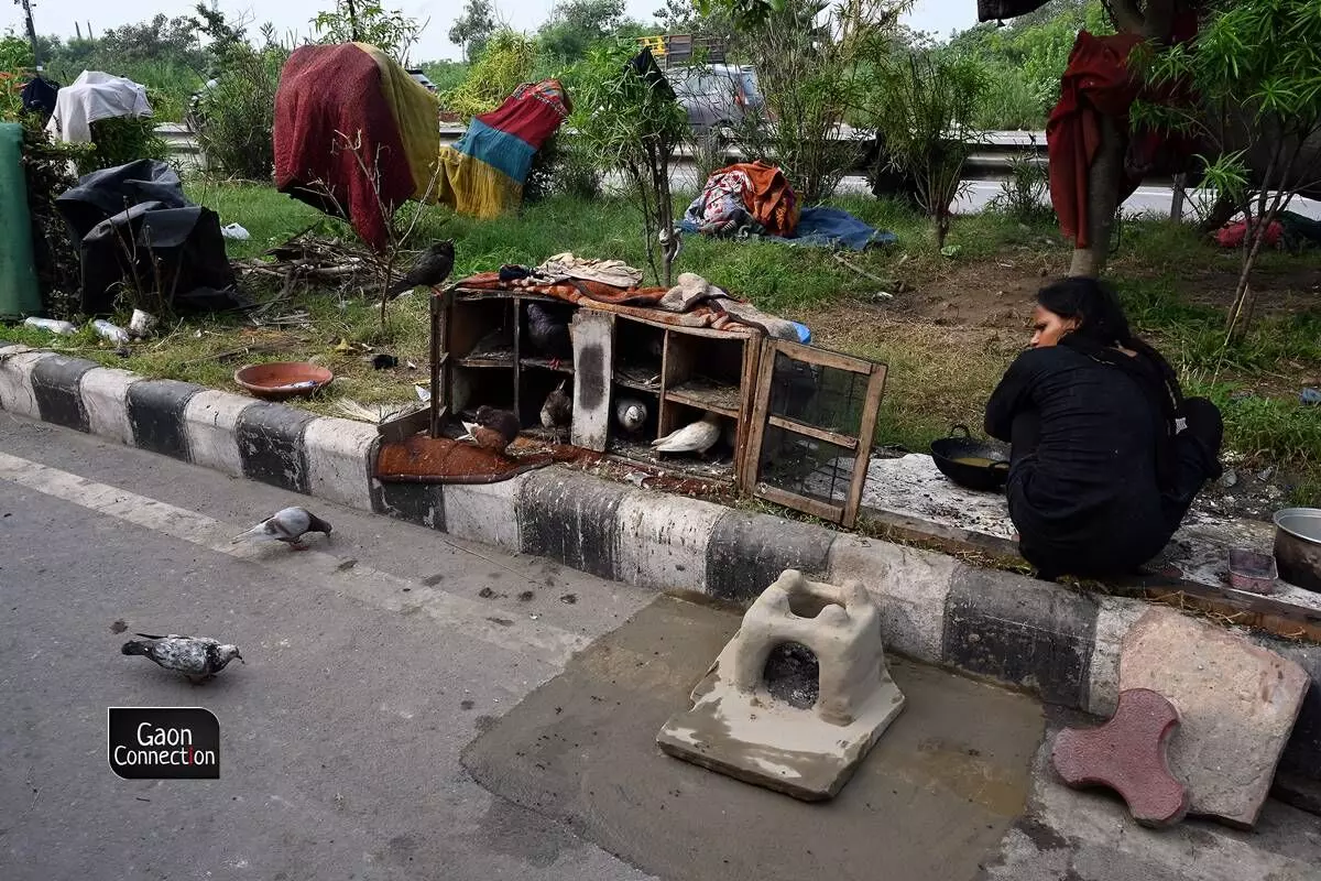 Not all who are displaced as as lucky as others. Some have to resort to living and cooking on the dividers on the road. Not all who are displaced as as lucky as others. Some have to resort to living and cooking on the dividers on the road.