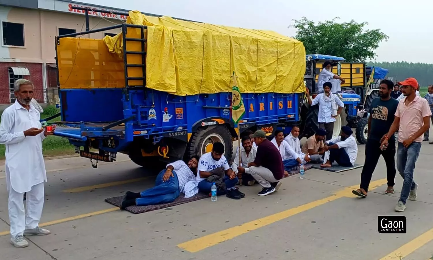 Some farmers sat in groups, some on the roadside, some in the shade of their tractors to take part in the protest. Some farmers sat in groups, some on the roadside, some in the shade of their tractors to take part in the protest.