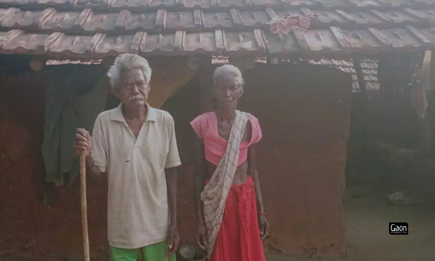 Bhuktu Murmus parents outside their house. Bhuktu Murmus parents outside their house.