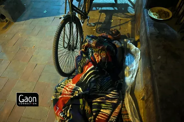 The rickshaw pullers often sleep beside their rickshaws to keep their source of livelihood safe at night. The rickshaw pullers often sleep beside their rickshaws to keep their source of livelihood safe at night.