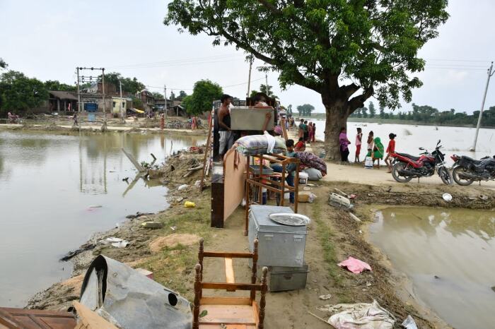 People loading their belongings onto an auto and leaving their village. Pic: Abhishek Verma 